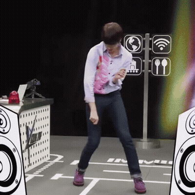 A Man Is Dancing In Front Of A Sign That Says ' Wifi ' On It GIF