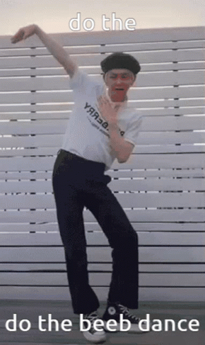 Man Doing Beeb Dance In Front Of Fence GIF