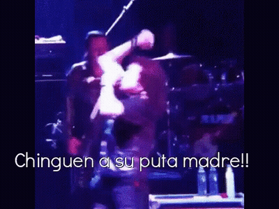 A Man Is Dancing On A Stage With The Words " Chinguen A Su Puta Madre " In The Corner GIF