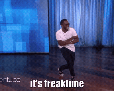 A Man Is Dancing On A Stage With The Words " It 'S Freaktime " Behind Him GIF
