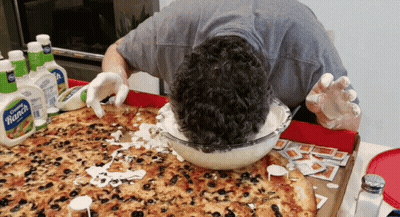 A Man Is Dipping His Head In Ranch Dressing GIF