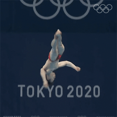 A Man Is Diving Into A Pool In Front Of A Tokyo 20 Sign GIF