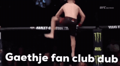 A Man Is Doing A Handstand In A Boxing Ring With The Words Gaethje Fan Club Dub In The Corner GIF