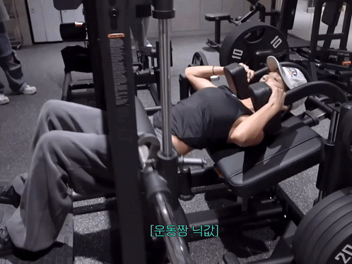 A Man Is Doing Exercises On A Machine With A Number 10 On It GIF
