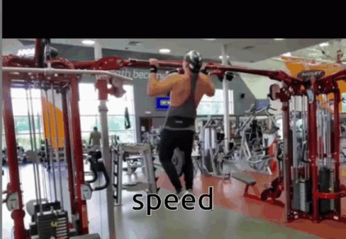 A Man Is Doing Pull Ups In A Gym And The Word Speed Is On The Screen GIF