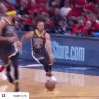 A Man Is Dribbling A Basketball On A Basketball Court In Front Of A Store.com Sign . GIF