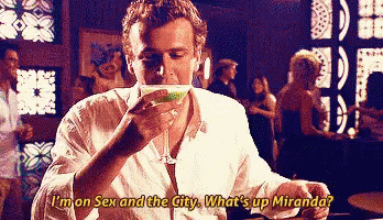 A Man Is Drinking A Martini And Saying I 'M On Sex And The City What 'S Up Miranda . GIF