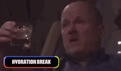 A Man Is Drinking From A Bottle With The Words Hydration Break Behind Him GIF