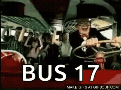 A Man Is Driving A Bus With A Crowd Of People On It And The Words Bus 17 On The Bottom . GIF