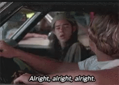 A Man Is Driving A Car And Says `` Alright , Alright , Alright '' . GIF