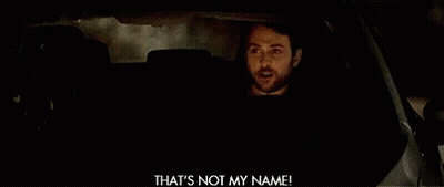 A Man Is Driving A Car At Night And Making A Funny Face While Holding A Cell Phone . GIF