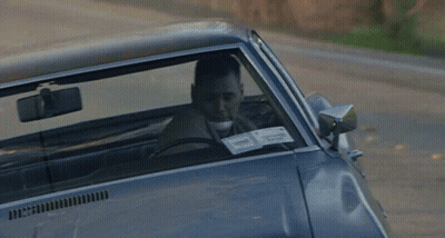 A Man Is Driving A Car With A License Plate That Says 40 On It GIF