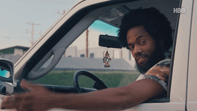 A Man Is Driving A Car With Hbo Written On The Bottom Right GIF