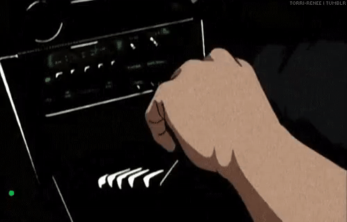 A Man Is Driving A Car With His Hands On The Steering Wheel . GIF