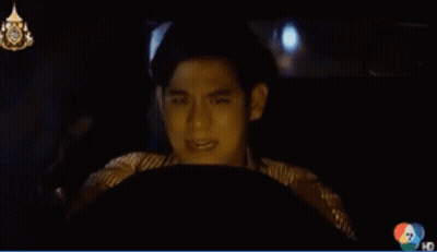 A Man Is Driving A Car With The Number 7 On The Bottom GIF