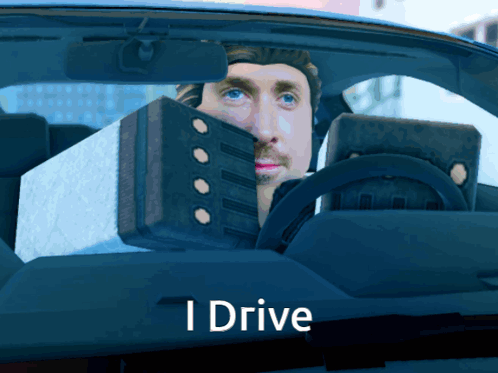A Man Is Driving A Car With The Words " I Drive " Below Him GIF