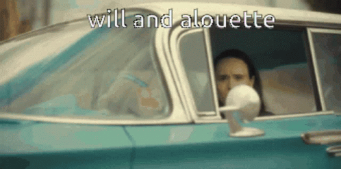 A Man Is Driving A Car With The Words Will And Alouette Written On The Side GIF