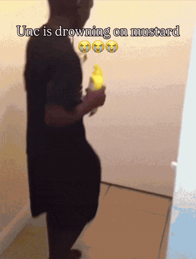 A Man Is Drowning On Mustard While Holding A Yellow Banana GIF