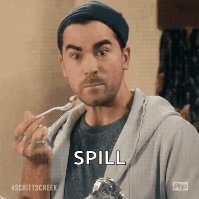 A Man Is Eating A Piece Of Meat With A Fork And A Spoon . GIF