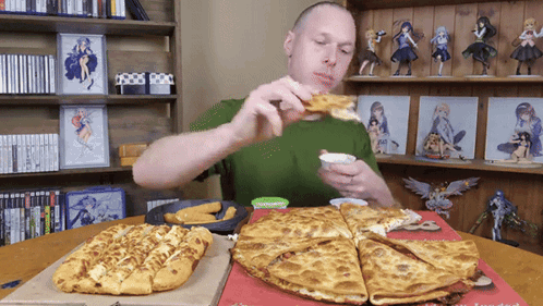 A Man Is Eating A Pizza And Dipping It In Ranch Dressing GIF
