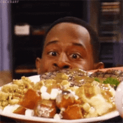 A Man Is Eating A Plate Of Food With The Word Cockbarf On The Bottom Right GIF