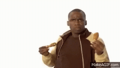 A Man Is Eating Chicken Wings And Listening To Music With Headphones . GIF