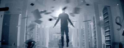 A Man Is Flying Through A Hallway With Papers Falling From The Ceiling GIF