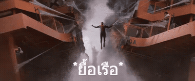 A Man Is Flying Through The Air In Front Of A Building That Says " Oa " GIF