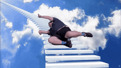 A Man Is Flying Through The Air On A Staircase GIF