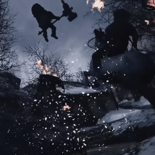 A Man Is Flying Through The Air While Holding A Torch GIF