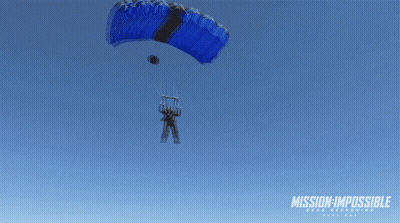 A Man Is Flying Through The Air With A Mission Impossible Logo In The Background GIF