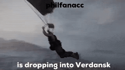 A Man Is Flying Through The Air With A Parachute And The Words `` Philfanacc Is Dropping Into Verdansk '' . GIF