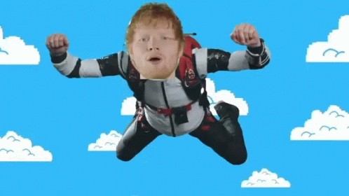 A Man Is Flying Through The Air With A Parachute On His Back That Says Ed Sheeran GIF