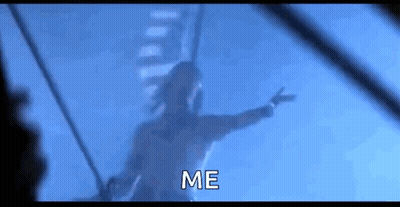 A Man Is Flying Through The Air With His Arms Outstretched And The Words `` Me '' Written Below Him . GIF