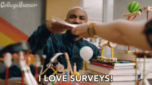 A Man Is Giving A Piece Of Paper To Another Man Who Is Sitting At A Desk With A Stack Of Books . GIF