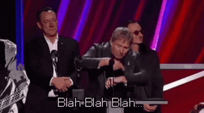 A Man Is Giving A Speech At A Podium With The Words Blah Blah Blah Behind Him GIF