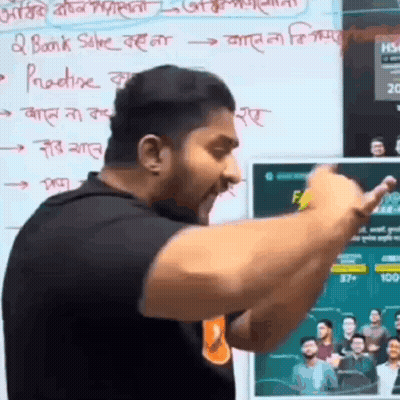 A Man Is Giving A Speech In Front Of A Whiteboard With Foreign Writing On It . GIF