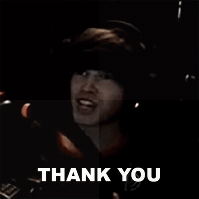 A Man Is Giving A Thumbs Up And The Words Thank You Are Above Him . GIF
