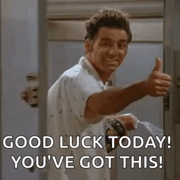 A Man Is Giving A Thumbs Up In Front Of A Door While Holding A Spray Bottle . GIF
