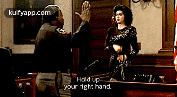 A Man Is Giving A Woman A High Five In A Courtroom While Another Man Says Hold Up Your Right Hand GIF