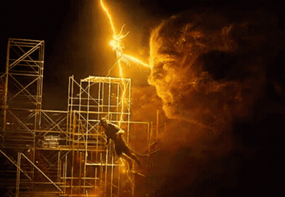 A Man Is Hanging From A Scaffolding While A Lightning Bolt Strikes Him . GIF