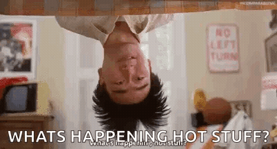A Man Is Hanging Upside Down From A Ceiling And Asking What Is Happening Hot Stuff . GIF