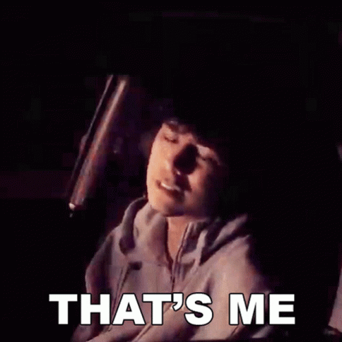 A Man Is Holding A Bat And The Words That 'S Me Are On The Screen GIF