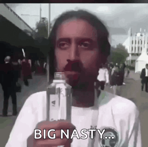 A Man Is Holding A Bottle Of Water And Says Big Nasty . GIF