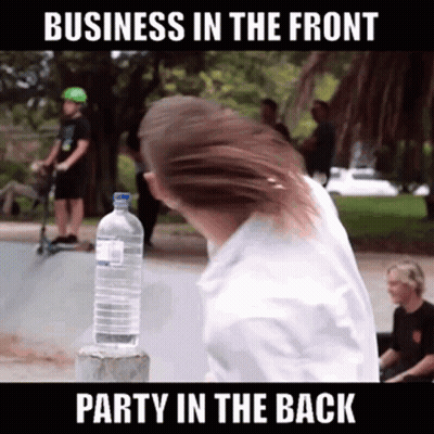 A Man Is Holding A Bottle Of Water In Front Of A Sign That Says Business In The Front GIF