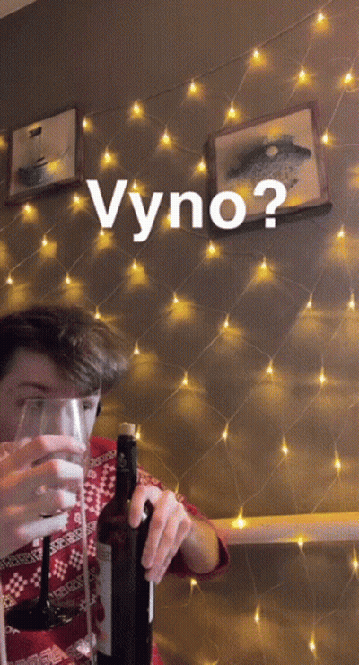 A Man Is Holding A Bottle Of Wine And A Glass With The Word Vyno Written Above Him GIF