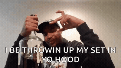 A Man Is Holding A Bottle With The Words " I Be Throwin Up My Set In Yo Hood " Above Him GIF