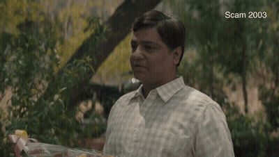 A Man Is Holding A Bouquet Of Flowers And The Words Congratulations Are On The Screen GIF