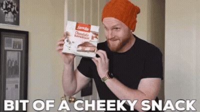 A Man Is Holding A Box Of Sara Lee Chocolate Bavarian GIF