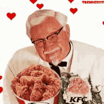 A Man Is Holding A Bucket Of Fried Chicken With Kfc Written On It GIF